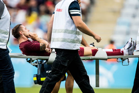 Ciprian Deac of Cluj is taken off the pitch
