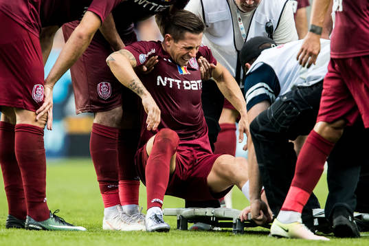 Ciprian Deac of Cluj is taken off the pitch