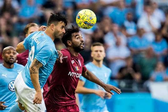 Behrang Safari of Malmö FF and Billel Omrani of Cluj