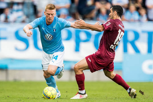 Anders Christiansen of Malmö FF and Juan Culio of Cluj