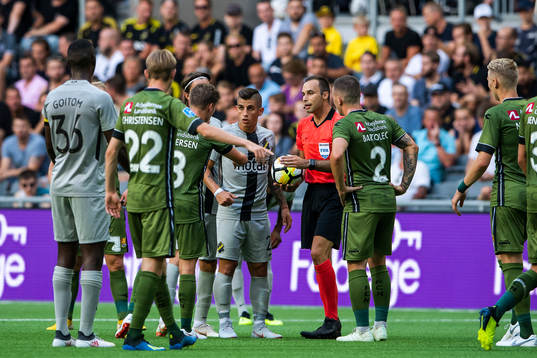 Players of of AIK and of Nordsjälland argue with match