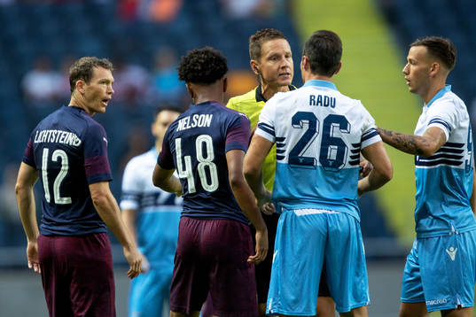 Stephan Lichtsteiner of Arsenal and Stefan Radu of Lazio