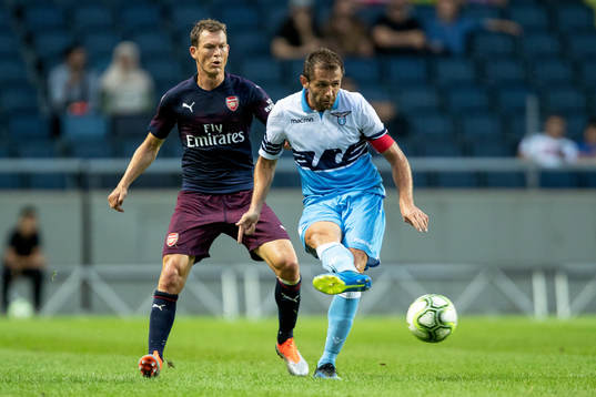 Stephan Lichtsteiner of Arsenal and Senad Lulic of Lazio