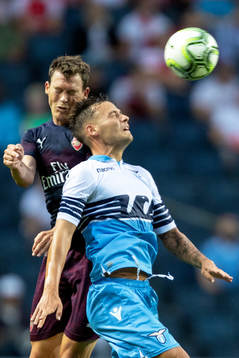 Stephan Lichtsteiner of Arsenal and Stefan Radu of Lazio