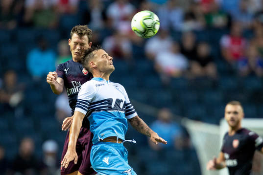Stephan Lichtsteiner of Arsenal and Stefan Radu of Lazio