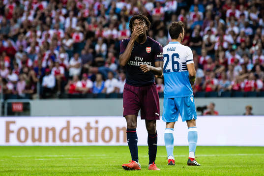 Alex Iwobi of Arsenal looks dejected