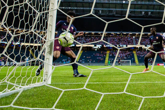 Reiss Nelson of Arsenal scores 1-0