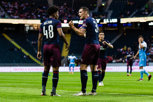 Reiss Nelson of Arsenal and Granit Xhaka of Arsenal