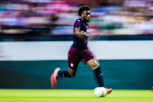 A panning shot of Alex Iwobi of Arsenal