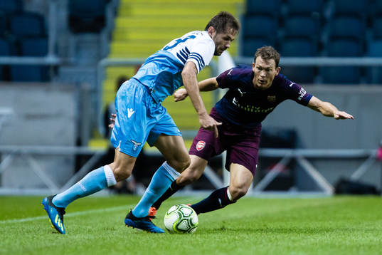 Stephan Lichtsteiner of Arsenal and Senad Lulic of Lazio