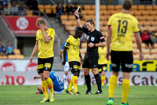 Ifeanyi Mathew of Lillestrøm gets a yellow card from Kai