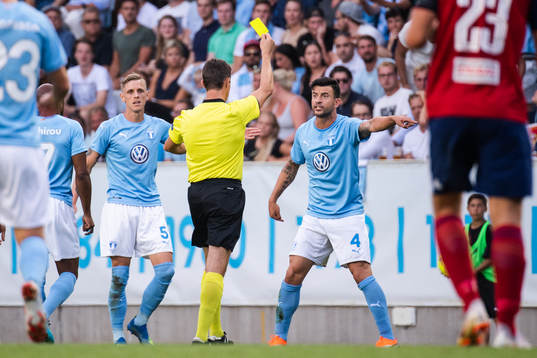 Behrang Safari of Malmö FF gets a yellow card