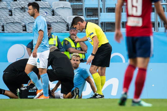 Rasmus Bengtsson of Malmö FF gets medical attention due to