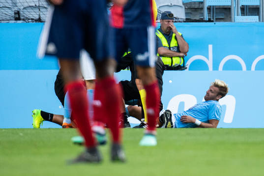 Rasmus Bengtsson of Malmö FF gets medical attention due to