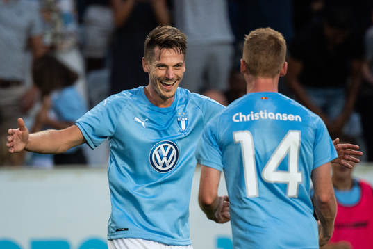 Markus Rosenberg celebrates with Anders Christiansen of