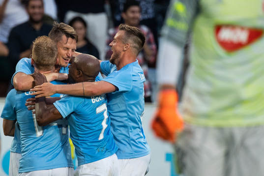 Markus Rosenberg celebrates with Anders Christiansen of