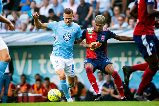 Arnór Ingvi Traustason of Malmö FF and Loïc Nego of Vidi