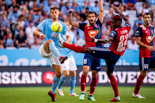 Markus Rosenberg of Malmö FF and Boban Nikolov and Stopira
