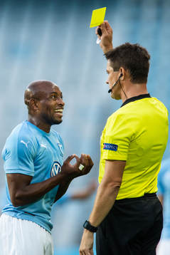 Fouad Bachirou of Malmö FF gets a yellow card from referee