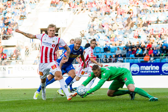 Runar Espejord of Tromsø and goalkeeper Eirik Holmen