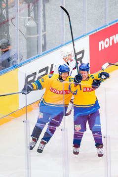 Tomas Brolin and Håkan Södergren of Sweden celebrate a