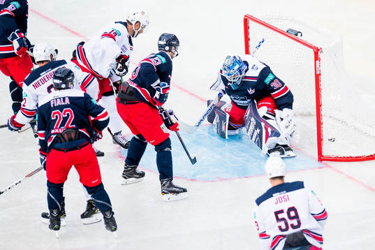 Goaltender Henrik Lundqvist of Team Henke lets in a goal