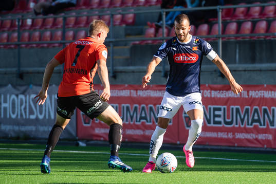 Tomas Kristoffersen of Åsane and Zlatko Tripic of Viking