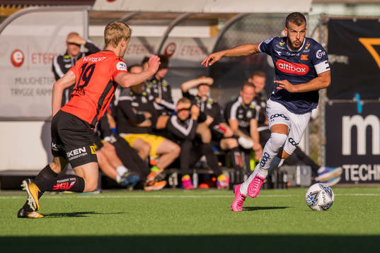 Simen Helland Lassen of Åsane and Zlatko Tripic of Viking