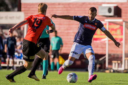 Simen Helland Lassen of Åsane and Zlatko Tripic of Viking