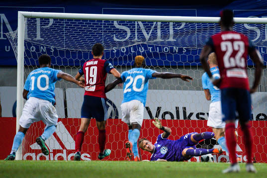 goalkeeper Johan Dahlin of Malmö FF saves a penalty kick