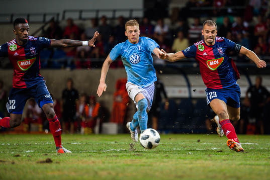 Anders Christiansen of Malmö FF against Stopira and Roland