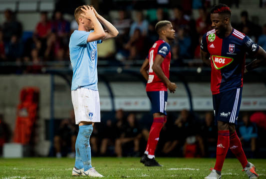 Anders Christiansen looks dejected