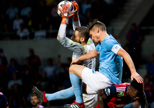 Markus Rosenberg of Malmö FF and goalkeeper Tomas Tujvelof