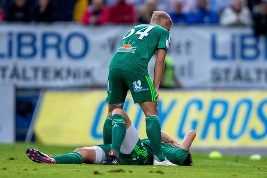 Dalkurds Robin Tranberg grinar illa