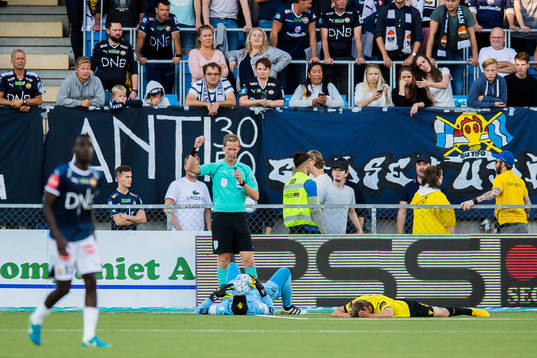 Goalkeeper Jonas Deumeland of Start lies down with an injury