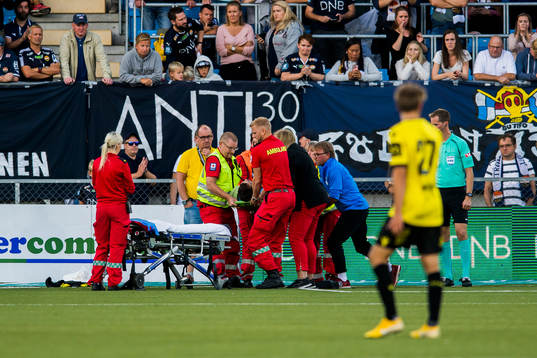 Goalkeeper Jonas Deumeland of Start lies down with an injury