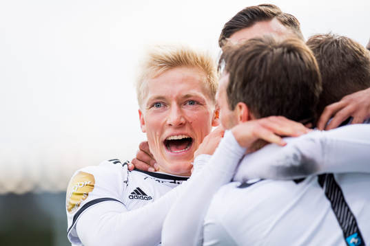 Birger Meling of Rosenborg celebrates with his teammates