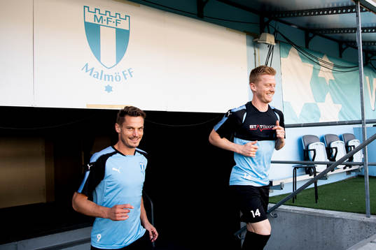 Markus Rosenberg and Anders Christiansen heading for the