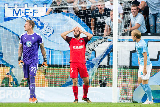 Marc Dal Hende of Midtjylland looks dejected behind
