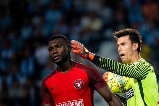Bubacarr Sanneh and goalkeeper Jesper Hansen of Midtjylland
