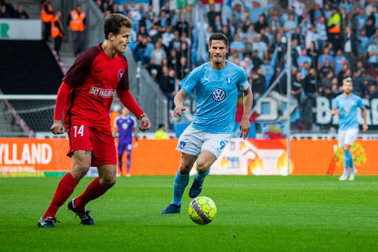 Alexander Scholz of Midtjylland and Markus Rosenberg of