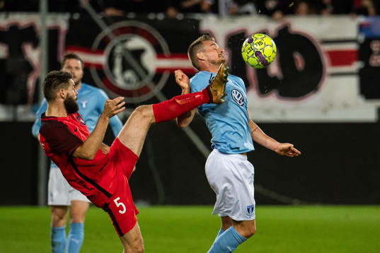 Joel Andersson of Midtjylland and Eric Larsson of Malmö FF