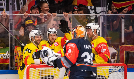Marc Kämpf of Bern celebrates with teammates
