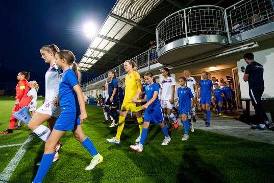 Maren Mjelde, goalkeeper Ingrid Hjelmseth of Norway and the