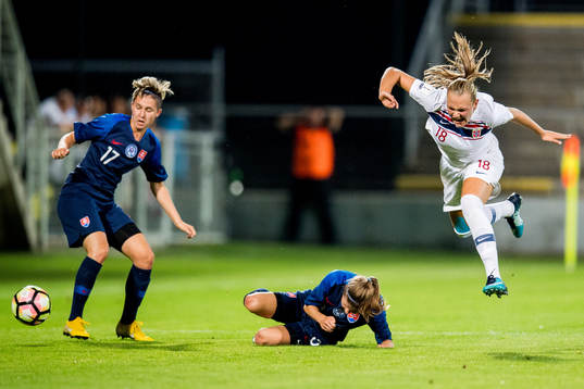 Frida Maanum of Norway is being tackled