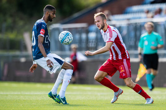 Amahl Pellegrino of Strømsgodset and Lasse Nilsen of