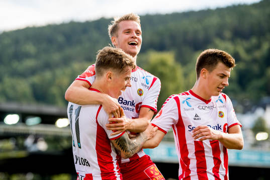 Robert Taylor of Tromsø celebrates with teammates Mikael