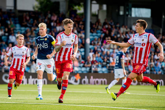 Robert Taylor of Tromsø celebrates with teammate Jostein