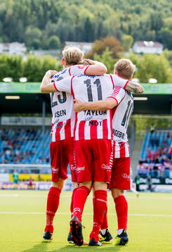 Robert Taylor of Tromsø celebrates with teammates Gjermund