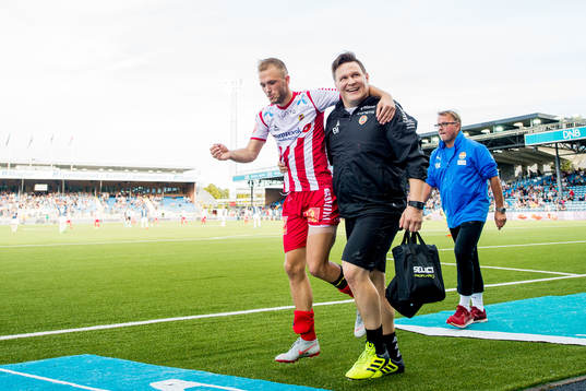 Lasse Nilsen of Tromsø limps off with an injury